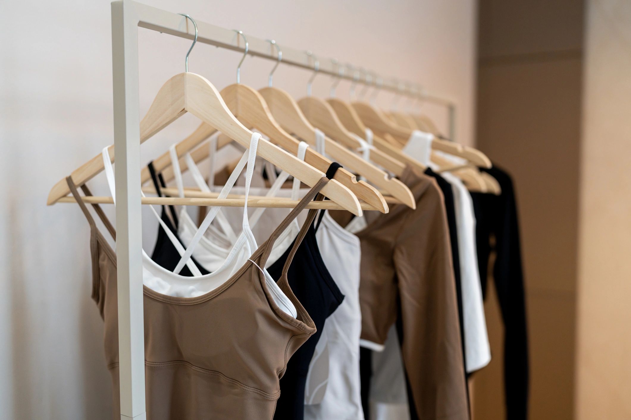 Sportswear displayed neatly on hangers in a retail setting
